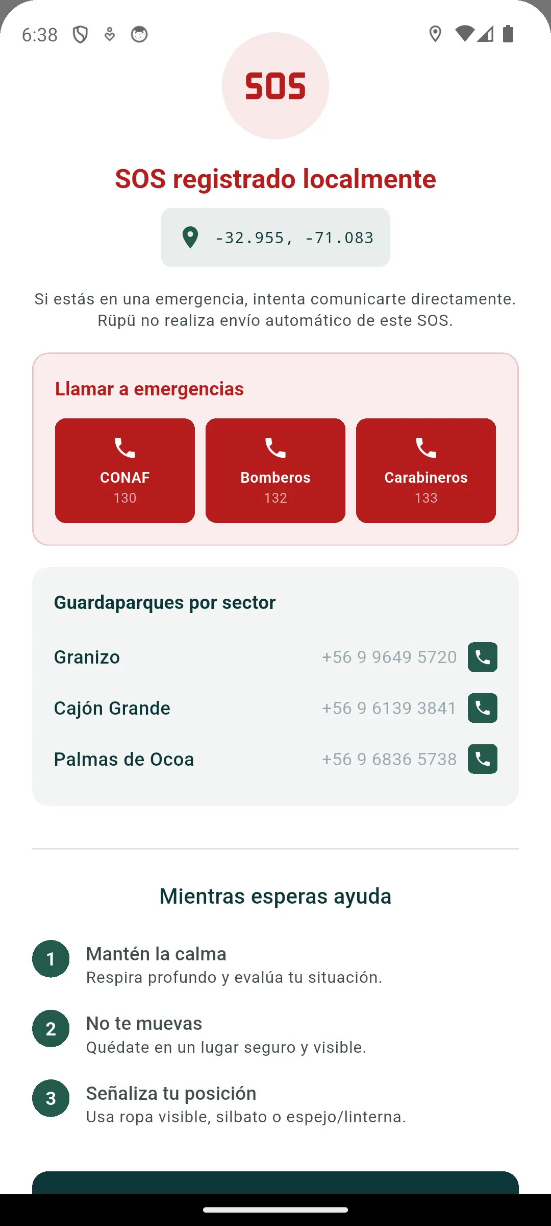Pantalla SOS de Rüpü con ubicación registrada, teléfonos de emergencia e instrucciones de espera.